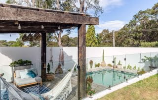 Backyard plunge pool in Southern Lake Macquarie with a recycled timber cabana